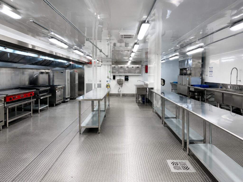 Interior of KCI’s 2,500 sq. ft. five-wide temporary hospital kitchen featuring commercial cooking, prep, warewashing, and stainless-steel work areas.